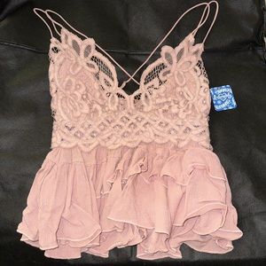 Medium size Free People Tank Top. Color: Mauve. New, never worn, with the tags.